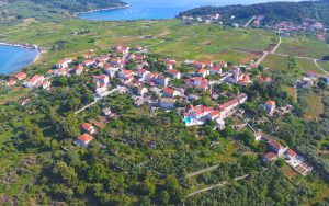 Aerial panoramic view of Lumbarda village sandy beaches and vineyards during a buggy safari tour in korcula