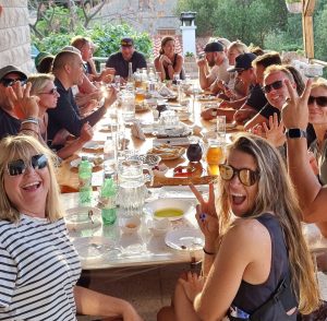 Dining table with fresh local food and wine on the private family terrace at the end of Korcula Buggy Official safari tour