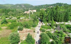 Buggy safari vehicles driving trough the traditional stone houses and streets of Zrnovo and Postrana villages and Korcula